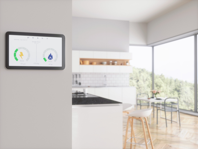 Home energy smart meter displayed in the kitchen to help control energy bills