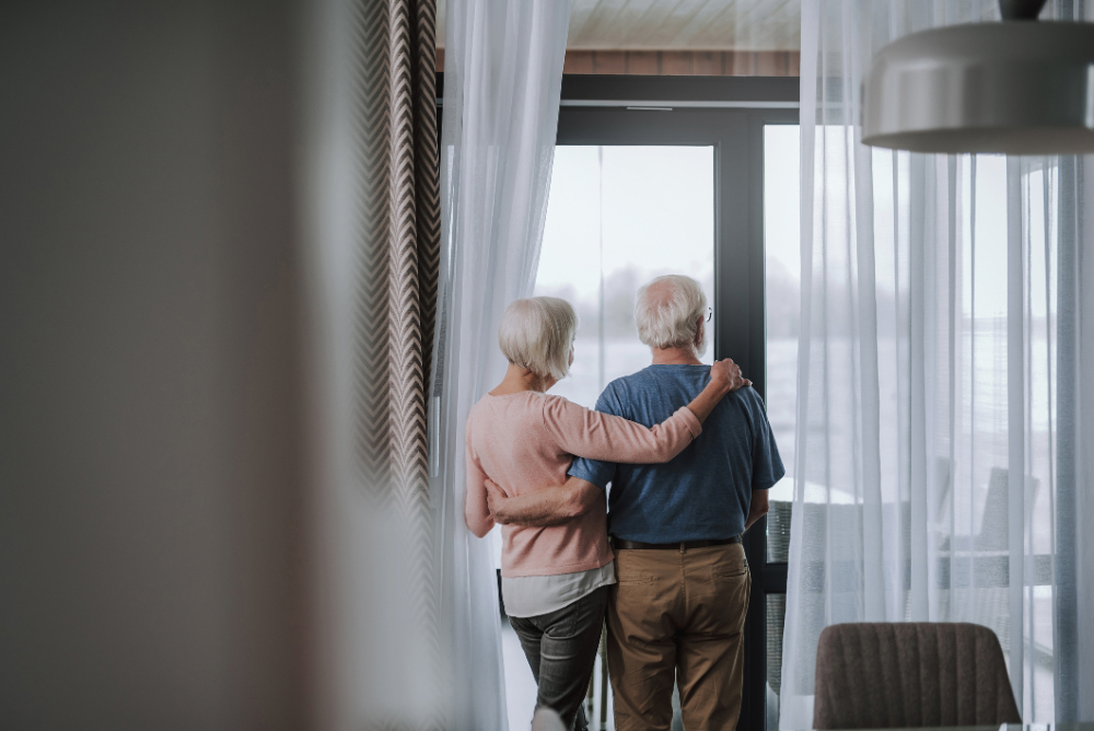 Back side pensioner couple enjoying time together