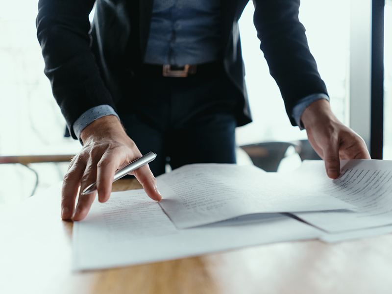 real estate agent man signing documents